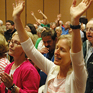 Carrie Carroll of Pontiac was among the 260 praising Jesus during the Charismatic Renewal Conference sponsored July 25 by the Diocese of Peoria at the Embassy Suites in East Peoria.