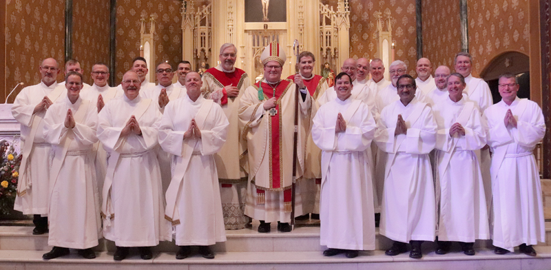 Bishop Louis Tylka is surrounded by the 20 permanent deacons he ordained Dec. 3 at St. Mary's Cathedral in Peoria. On his right is Msgr. Philip Halfacre, vicar general, and on his left is Msgr. Timothy Nolan, episcopal vicar for the permanent diaconate. (The Catholic Post/Jennifer Willems)
